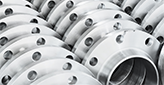 circular stainless steel parts in organized rows