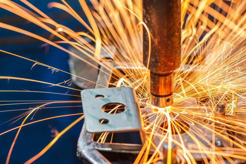 A spot welding machine welds a car part