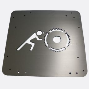 aluminum laser cut sign with a man pushing a saw