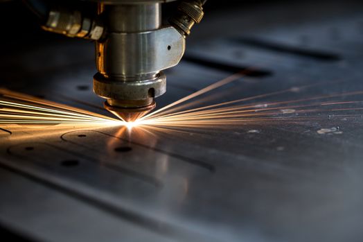 Laser cutting of metal sparks fly