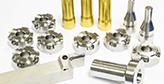 assorted milled parts displayed on a white background