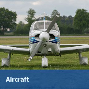 Small sport airplane on grass airport